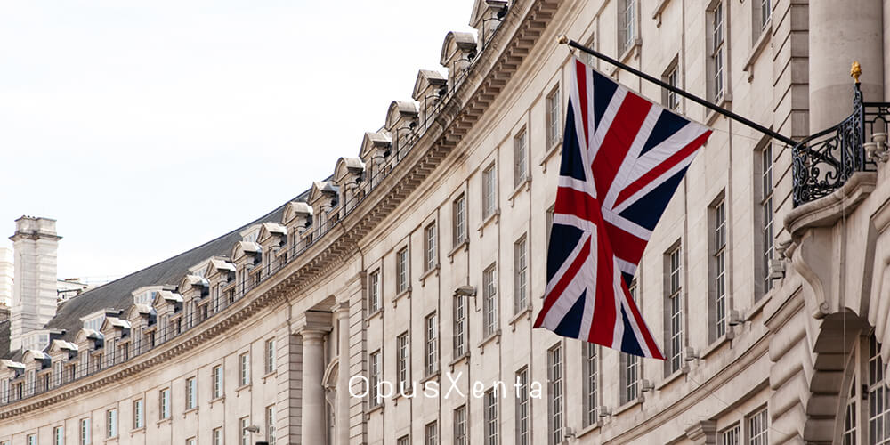 British Flag Flying in Front of Cream Building