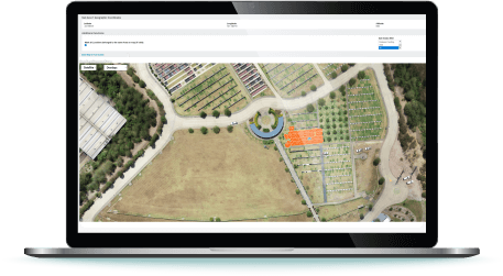 Laptop with Aerial Image of Cemetery with Graves Mapped on Screen